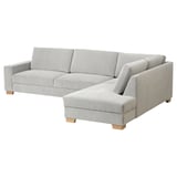 A modern corner sofa, the SÖRVALLEN in light grey fabric with wooden legs, featuring a chaise longue and minimalist design.
