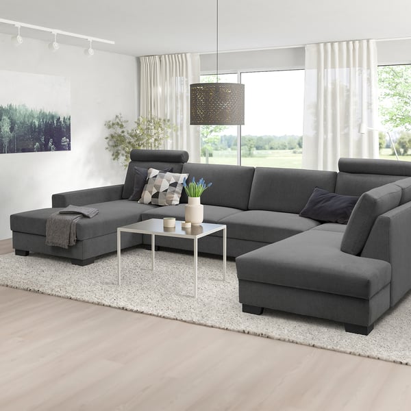 Modern gray l-shaped SÖRVALLEN sofa, large & cozy, with cushions & coffee table in bright living space.