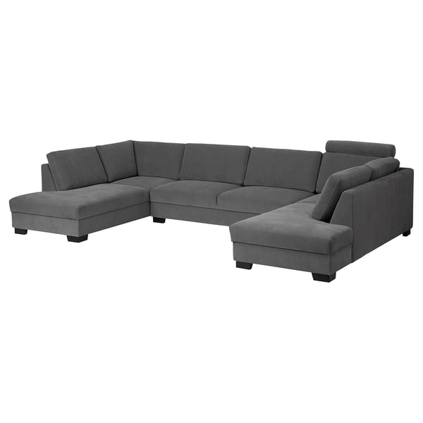 A modern, dark grey SÖRVALLEN sectional sofa with a minimalist design. It multiple cushions and a chaise lounge.