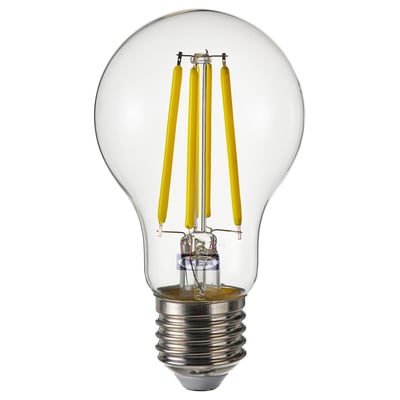 A spherical, energy-efficient SOLHETTA light bulb with a glass cover and yellow led filaments.
