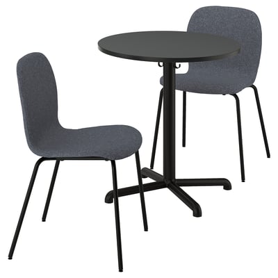 Image depicts a black round table with two gray upholstered chairs. Modern design, suitable for dining or study.