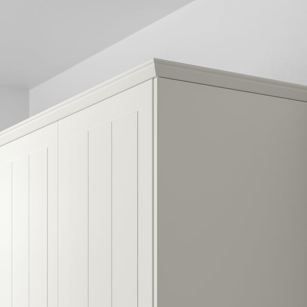 White panel with vertical grooves and top lighting.