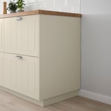 Kreative STENSUND beige fiberboard kitchen cabinet, sleek & modern, fits perfectly under counter.