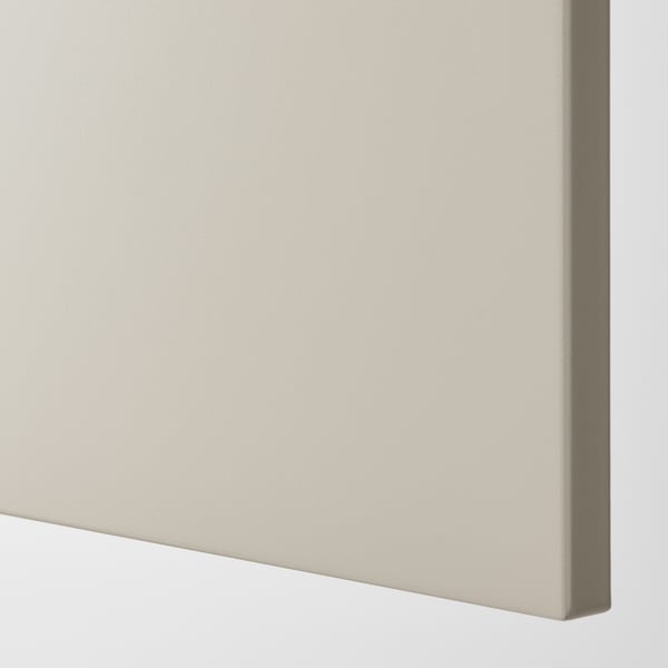 A close-up of a beige cover panel, smooth and lacquered, reflecting quality and durability.