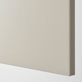 A close-up of a beige cover panel, smooth and lacquered, reflecting quality and durability.