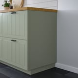 STENSUND green cabinet panel, fiberboard, rectangular, light stains-resistant finish, fits corners, smaller than walls.