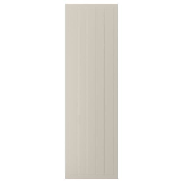This image shows a beige STENSUND cabinet door with a grooved panel design. The door is rectangular and made from fiberboard with a lacquered finish.