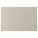A beige STENSUND cabinet door with a rectangular shape and grooved panel design, made of fiberboard.