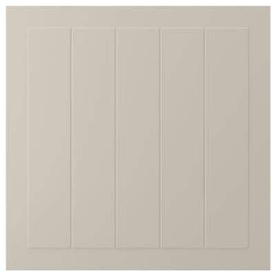 This image shows a beige STENSUND cabinet door with vertical grooves and a rectangular design.