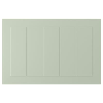 A green, rectangular STENSUND cabinet door with grooved panels. Its made from fibreboard and coated with polyurethane and acrylic paint.