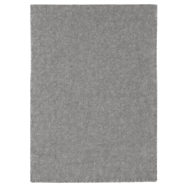 Gray STOENSE rug, soft & sound-dampening, plain design, suitable for bedrooms/living rooms.