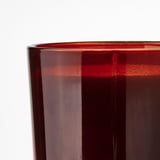 Close-up of a sleek, red-tinted glass candle holder, showcasing its smooth, glossy finish.