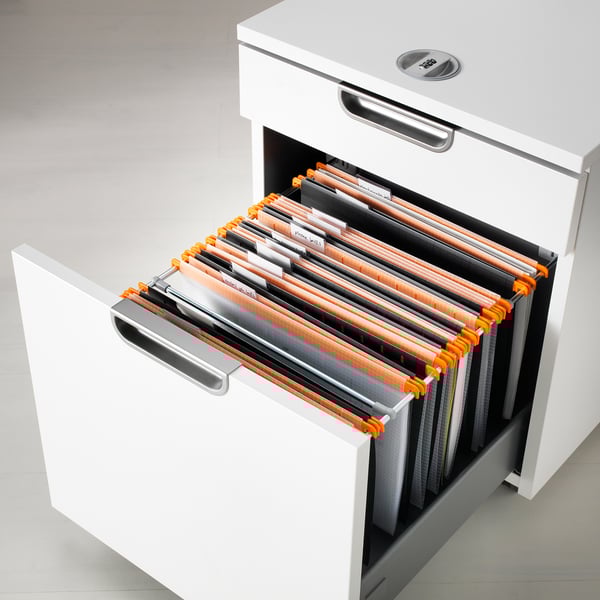 Open white filing cabinet showing orange and gray file folders labeled and holding a4 paper.