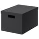 A TJENA dark grey storage box. Its rectangular with a lid, made from recycled paperboard. Theres a cut-out handle for easy access.