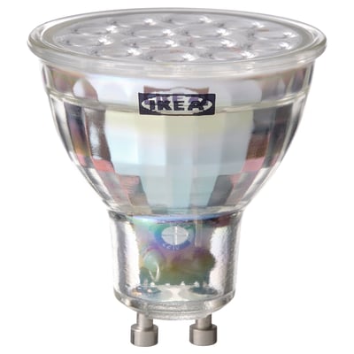 Ikea TRÅDFRI led smart light bulb, clear, round shape with metallic base.
