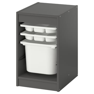 A gray TROFAST storage unit with white containers and trays. It has an open front and multiple compartments for organizing items.
