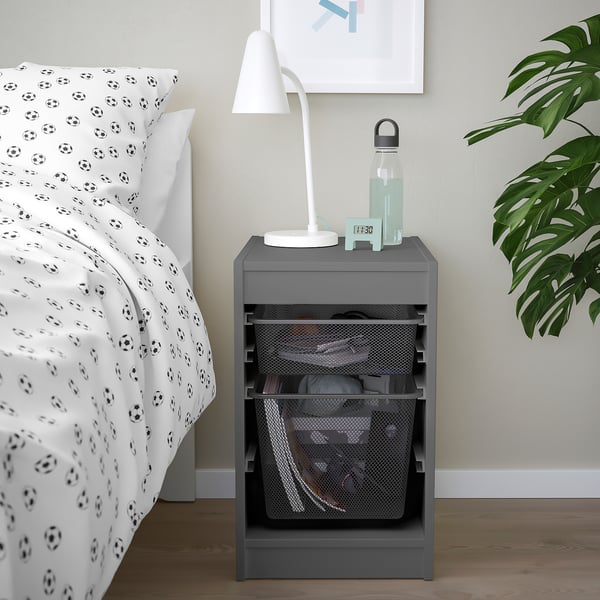 Kids bedroom with TROFAST grey storage unit by soccer-themed bed