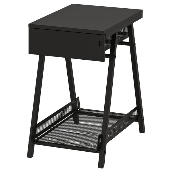 A black TROTTEN storage unit with a drawer and a mesh shelf, ideal for small and large items.