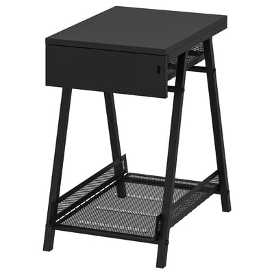 A black TROTTEN storage unit with a drawer and a mesh shelf, ideal for small and large items.