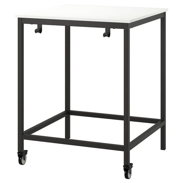Trotted mobile table, black frame, white top, four wheels, modern design.