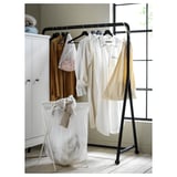 Black TURBO garment rack with clothes. Wheels and is easily movable.