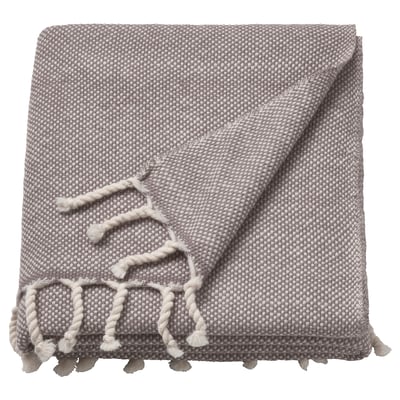 A grey wool throw blanket with fringe edges, soft and warm.