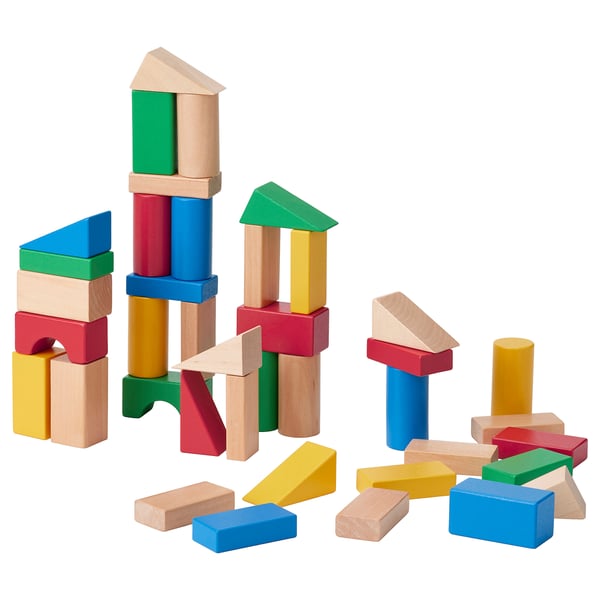 Wooden blocks in colors and shapes, creatively stacked for kids construction play.