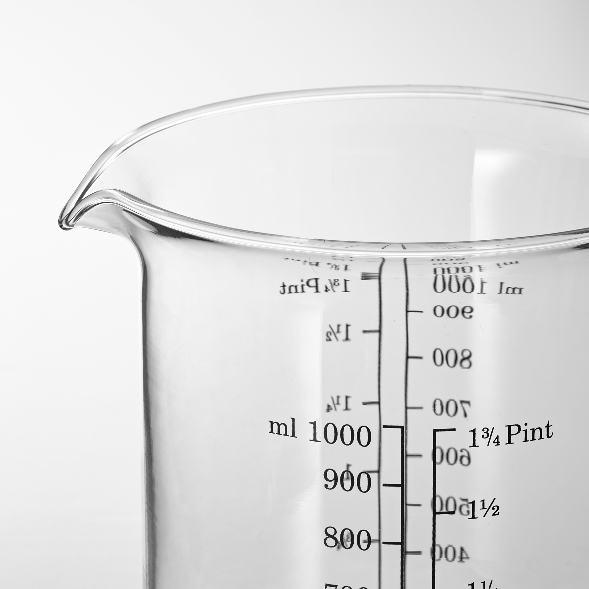 Glass measuring jug with clear markings up to 1000 ml; spout for easy pouring.