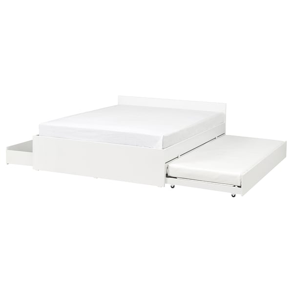 A white VIHALS bed frame with a trundle and storage boxes. It a clean, modern design with a slatted base and castors for easy movement.