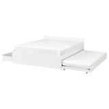 A white VIHALS bed frame with a trundle and storage boxes. It a clean, modern design with a slatted base and castors for easy movement.