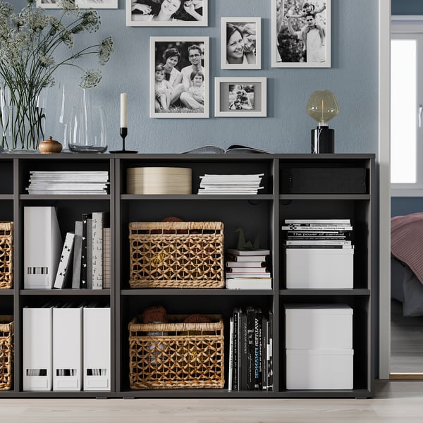 Modern black VIHALS storage unit with personal items.