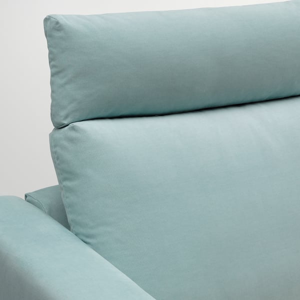 Sofa section detail: soft, plush fabric; clean lines; comfortable pillows.