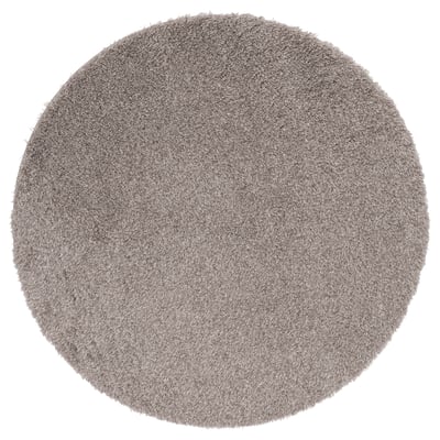Soft grey shaggy circular rug, made from recycled polyester. Provides a cozy feel and reduces noise.