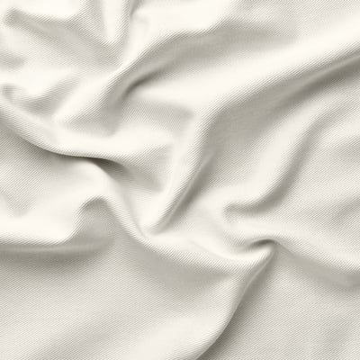 Gros plan d’un tissu texturé blanc et net mettant en valeur un tissage fin et des plis subtils, mettant en valeur la qualité et la texture lisse.