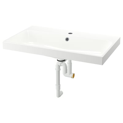 Cette image montre un lavabo BACKSJÖN rectangulaire blanc aux bords lisses et au design minimaliste, doté d’un drain et d’un trou pour le robinet.