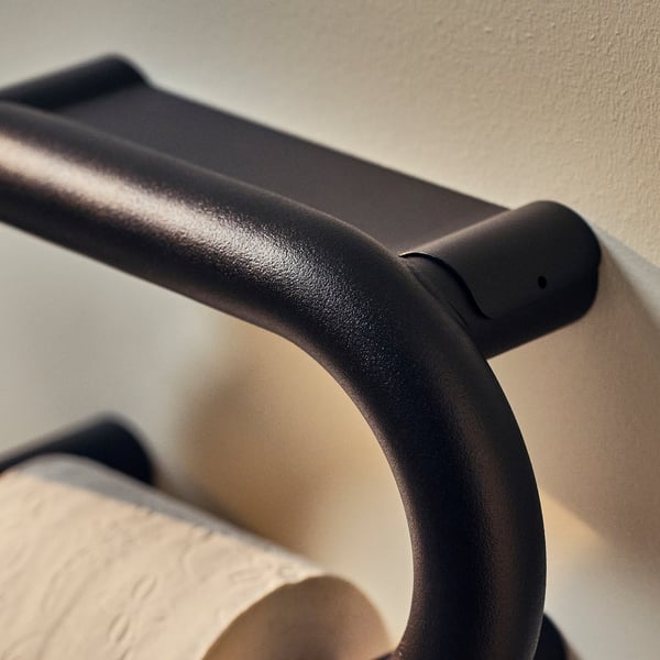 Porte-rouleau de papier toilette BÄSINGEN noir en gris foncé, mural, au design incurvé sans vis apparentes.