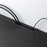 Banc TV noir avec pieds réglables et sorties de câbles, assurant la stabilité et le câblage organisé.