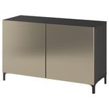 Un buffet ikea BESTÅ en or et noir. Il a deux portes et un design élégant.