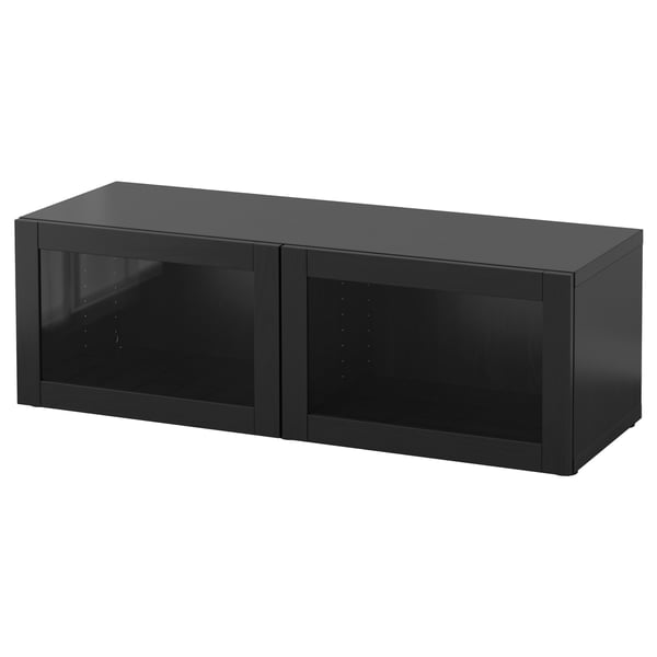 Un meuble de rangement BESTÅ noir avec des portes vitrées. Il s’agit d’un design rectangulaire élégant avec une finition lisse.