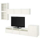 Meuble TV BESTÅ blanc moderne avec des portes, des armoires et des tiroirs en verre, offrant un grand espace de rangement. Parfait pour un espace de vie propre et organisé.