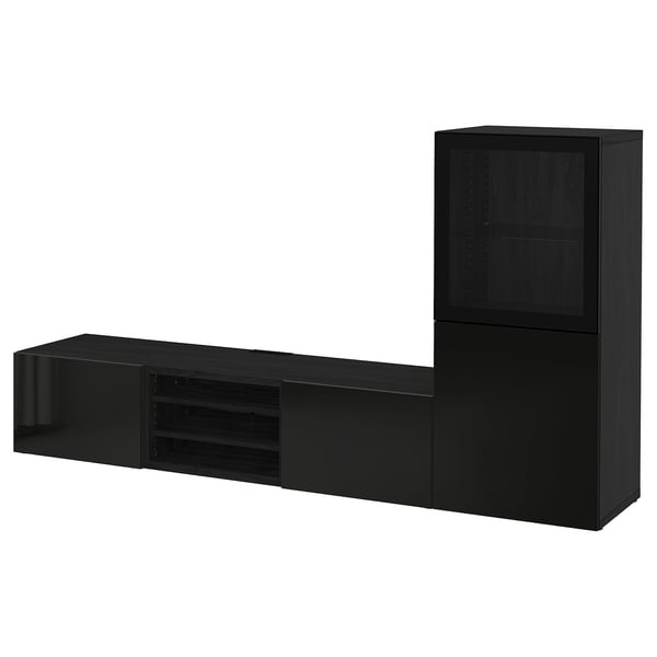 Meuble TV BESTÅ noir avec étagères et tiroirs pour un rangement organisé.