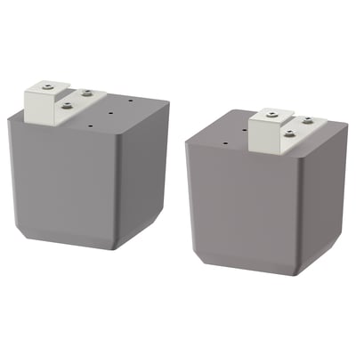 Deux pieds de meubles carrés gris avec pieds réglables, design épuré.