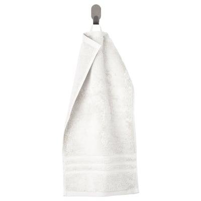 Serviette blanche BROKGLIM avec bordure tissée, suspendue. Coton biologique doux.