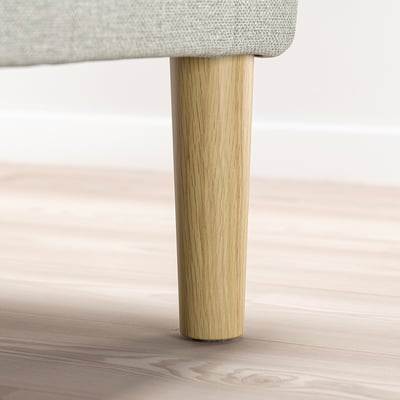 Siège rembourré pour un pied de meuble en bois.