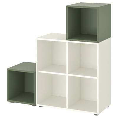 Rangement modulaire EKET : étagères blanches et boîtes vertes. Design cubique et minimaliste.
