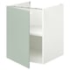 Armoire blanche avec porte gris-vert pâle, ouverte montrant l’étagère ; Design moderne et minimaliste.