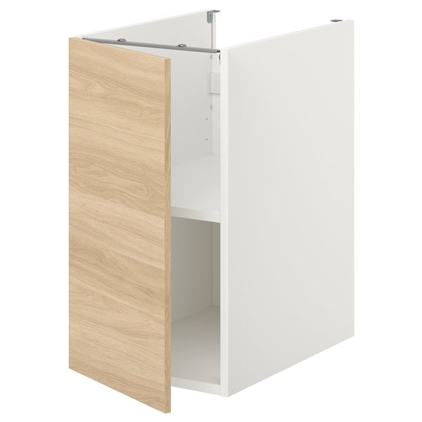 Armoire ENHET blanche avec porte en bois clair et étagère unique.