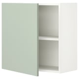 Une armoire murale ENHET en vert sauge, avec une forme rectangulaire simple et une seule étagère à l’intérieur.
