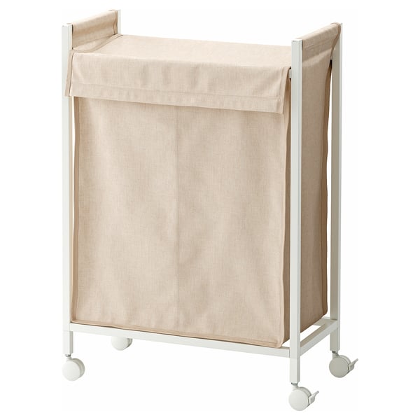 Un panier à linge ENHET blanc sur roulettes avec un sac en tissu beige. Il est rectangulaire, portable et dispose d’un couvercle pour dissimuler le contenu.