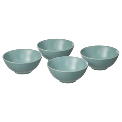 Quatre bols ronds en céramique bleu clair sont assemblés, avec un design simple et lisse et une forme uniforme avec une finition émaillée mate.